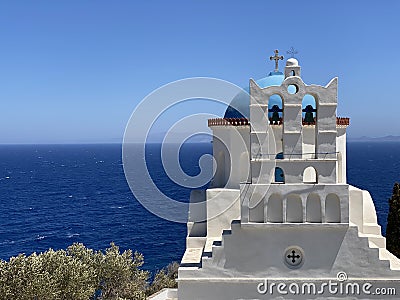 Traditional bells tower and blue dome of the orthodox white churches, Sifnos island, Greece Stock Photo