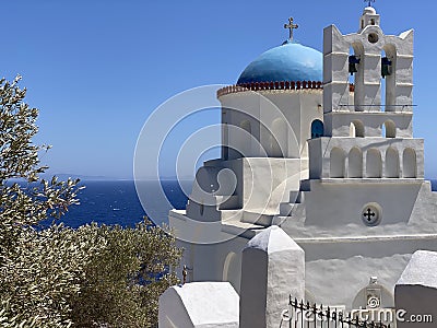 Traditional bells tower and blue dome of the orthodox white churches, Sifnos island, Greece Stock Photo