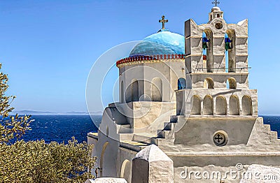 Traditional bells tower and blue dome of the orthodox white churches, Sifnos island, Greece Stock Photo