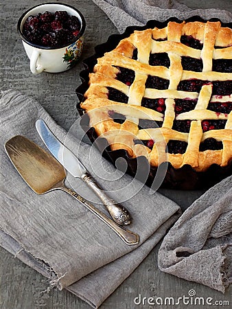 Traditional berries yeast pie tart on rustic wooden background. Homemade sweet cake. Baked pastry food. Top view. Space for text. Stock Photo