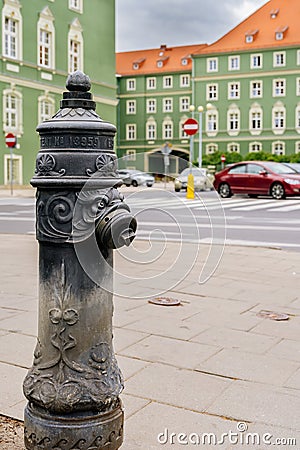 Traditional black hydrant with gryphon head from Stettins emblem Stock Photo