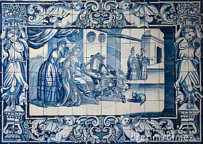 Traditional blue tiles or azulejos decorated with a domestic scene. Lisbon. Portugal Stock Photo