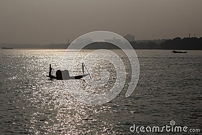 Traditional boat on ganga river in kolkata india in sunset Stock Photo