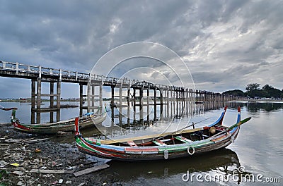 Traditional boats at U Bein bridge. Amarapura. Mandalay region. Myanmar Stock Photo