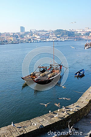 Traditional boats with wine barrels. Porto. Portugal Stock Photo