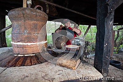 Traditional brandy manufacturing in Maramures county , Romania Editorial Stock Photo