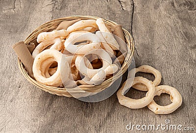 Traditional brazilian polvilho or starch biscuit on a basket over wooden table Stock Photo