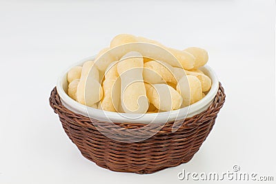 Traditional Brazilian starch biscuit called biscoito de polvilho in a basket isolated in white background Stock Photo