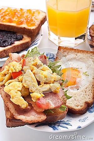Traditional breakfast with juice, eggs and bacon Stock Photo