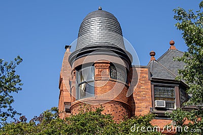 Traditional brick building with an ornate cast iron tower adorning the top in New York City, USA. Editorial Stock Photo