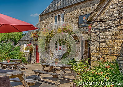 Traditional British country Pub at Frampton Mansell in The Cotswolds Editorial Stock Photo