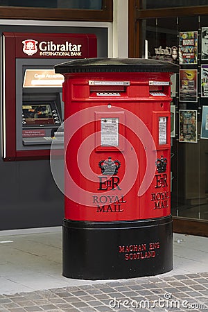 Traditional british red letter box and ATM Gibraltar Editorial Stock Photo