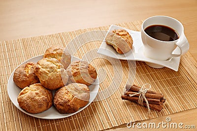 Traditional bulgarian cookies, called kurabiiki, cup of coffee and tied cinnamon sticks. Warm and delicious autumn breakfast Stock Photo