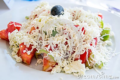 Traditional Bulgarian salad with tomatoes, cucumbers, cheese and olive Stock Photo