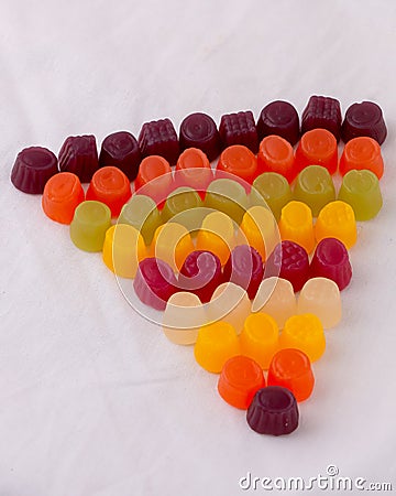 Triangle of colourful jelly Midget Gems. Traditional candy -British corner shop favorite. Stock Photo