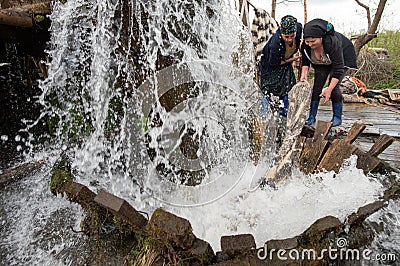 Traditional carpet washing in Maramures county , Romania Editorial Stock Photo