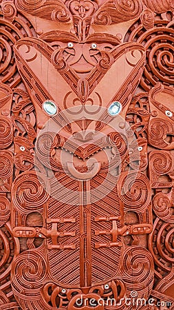 Traditional Carved Maori Board. Red wood Editorial Stock Photo
