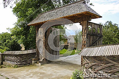 Traditional carved wooden gate in the old vilage Sighetu Marmatiei,Maramures, Romania. Stock Photo