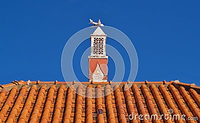 Traditional chimney on a housetop in Portugal Stock Photo