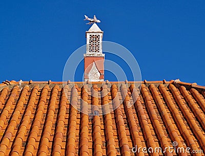Traditional chimney on a housetop in Portugal Stock Photo
