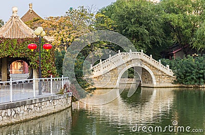 Traditional chinese arch bridge in Renmin park in Tianjin Stock Photo