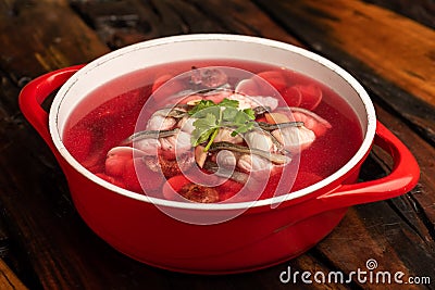 Traditional Chinese banquet dishes, red mushroom pure fish soup Stock Photo