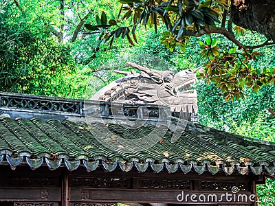 Traditional chinese building with ornate roof and red windows at Yu Gardens, Shanghai, China Stock Photo