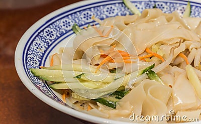 Traditional chinese cold skin noodles Liang pi with vegetables Stock Photo