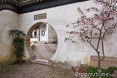 Traditional Chinese garden with round entrance Stock Photo