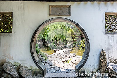 Traditional Chinese garden white round entrance. Stock Photo