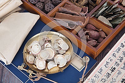 The traditional Chinese medicine licorice in the scale and all kinds of herbs in the medicine box Stock Photo