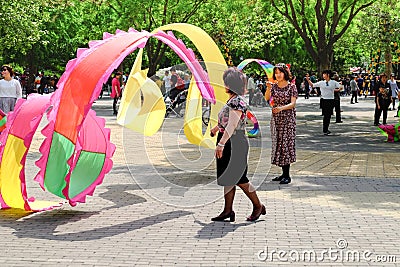 Traditional Chinese Silk Dance in a park. Editorial Stock Photo