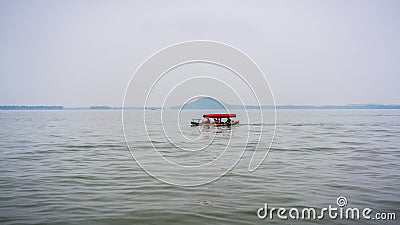 Traditional chinese small boat in Wuhan city Donghu east lake and Moshan hill in China Editorial Stock Photo