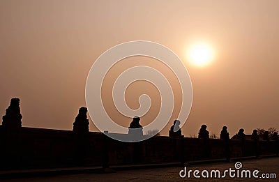 Traditional Chinese Stone Lion Silhouette on Marco Polo Bridge Stock Photo