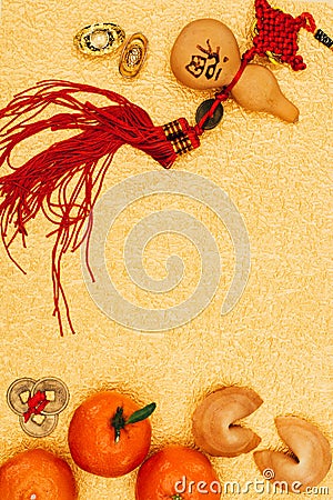 Traditional chinese talisman with tangerines and fortune cookies on golden surface, Chinese New Year concept Stock Photo
