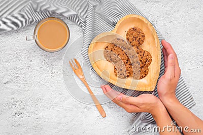 Traditional chocolate chip cookies on heart shape plate. Stock Photo
