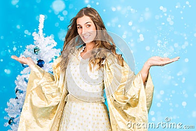 Traditional Christmas Angel in front of tree Stock Photo