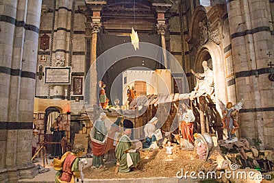 Traditional Christmas crib scenery in Duomo di Siena. Metropolitan Cathedral of Santa Maria Assunta. Tuscany. Italy. Editorial Stock Photo