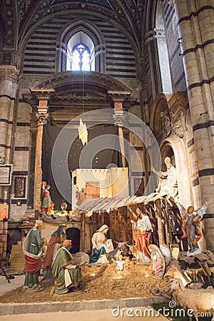 Traditional Christmas crib scenery in Duomo di Siena. Metropolitan Cathedral of Santa Maria Assunta. Tuscany. Italy. Editorial Stock Photo