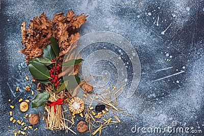 Traditional Christmas decoration in Serbia called Badnjak, Oak branch on rustic blue surface Stock Photo