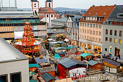 Traditional christmas market in the historic center of Nuremberg, Germany. Decorated with garland and lights sale stalls Stock Photo