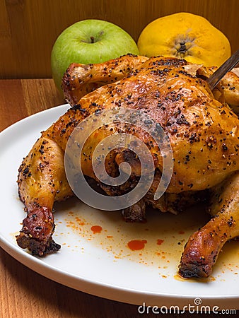 Traditional Christmas roasted chicken with apples and quince Festive dinner concept Stock Photo