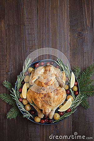 Traditional Christmas roasted turkey with spices and rosemary on wooden table. Top view Stock Photo