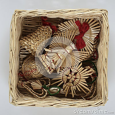 traditional Christmas straw decorations in a wicker box Stock Photo