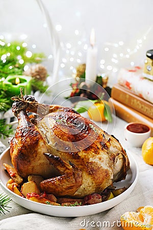 Traditional Christmas whole baked chicken with apples and thyme Stock Photo