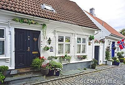 Traditional cobblestone street with wooden houses in the old town of Stavanger, Norway Editorial Stock Photo