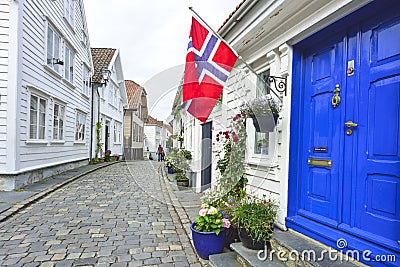 Traditional cobblestone street with wooden houses in the old town of Stavanger, Norway Editorial Stock Photo