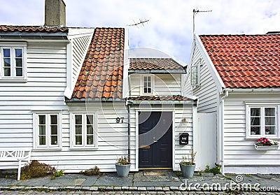 Traditional cobblestone street with wooden houses in the old town of Stavanger, Norway Editorial Stock Photo