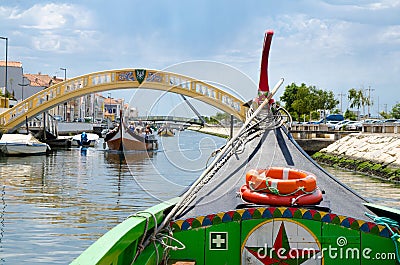 Traditional colorful boat Moliceiro on canal at Aveiro city, Por Editorial Stock Photo