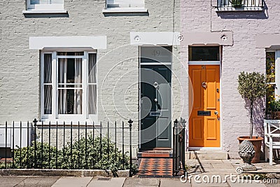 Traditional colourful bright doors on houses in Barnes, London, Editorial Stock Photo